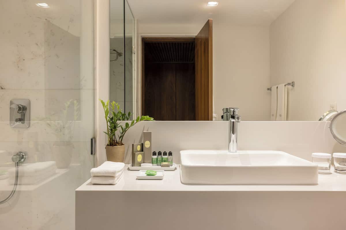 junior suite | bathroom | designer toiletries, hair dryer, bathrobes, slippers