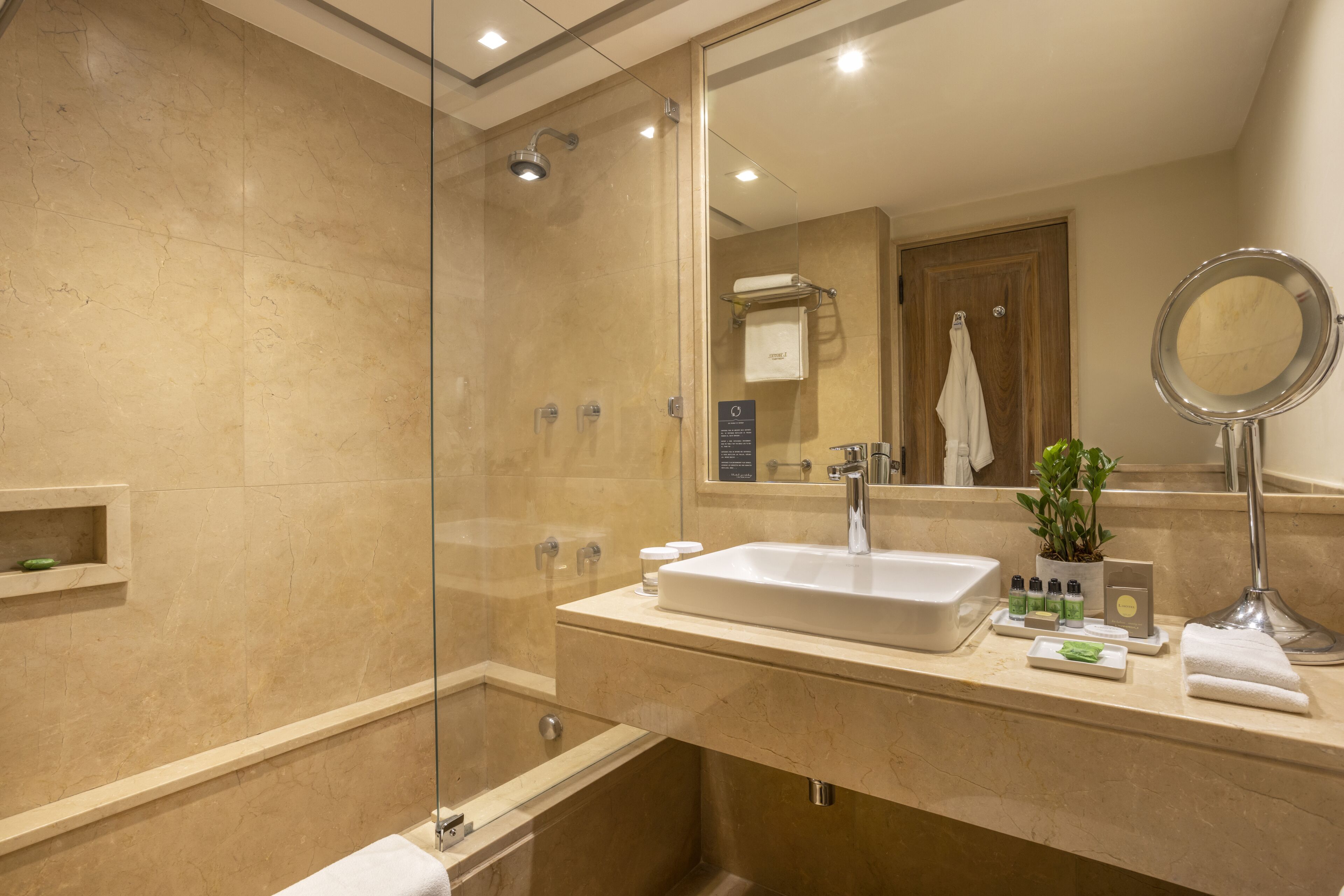 designer toiletries, hair dryer, bathrobes, slippers