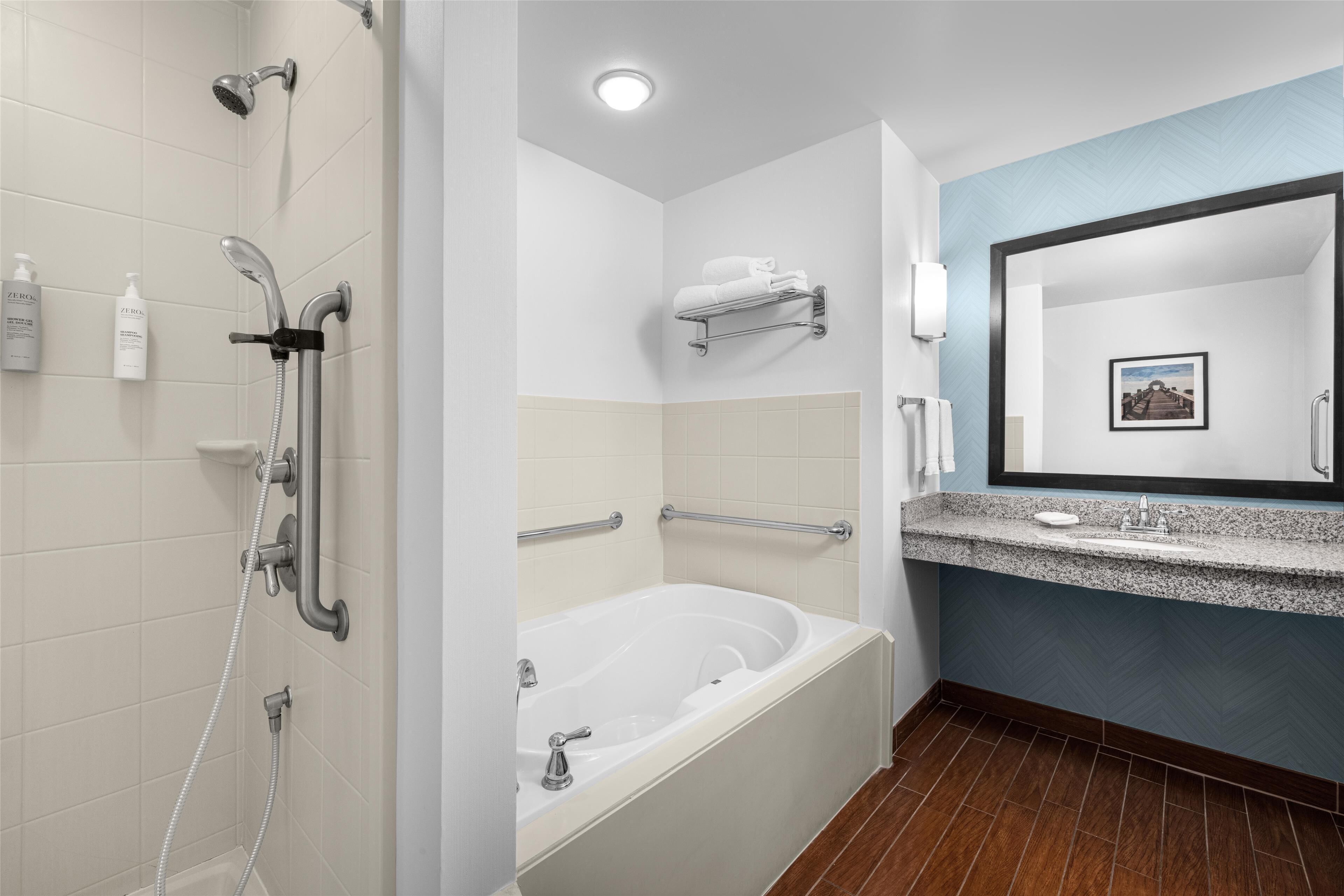 combined shower/bathtub, designer toiletries, towels, soap