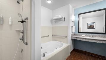 Combined shower/bathtub, designer toiletries, towels, soap