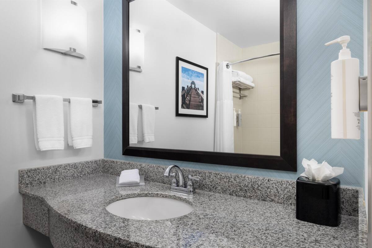 room, 2 queen beds | bathroom | combined shower/bathtub, designer toiletries, towels, soap