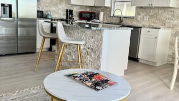 Fridge, microwave, stovetop, coffee/tea maker