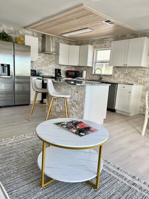 Fridge, microwave, stovetop, coffee/tea maker