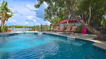 Outdoor pool, free pool cabanas, pool umbrellas