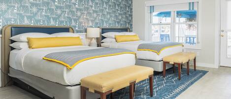 A double bed with a headboard, two bedside tables, and a bench.