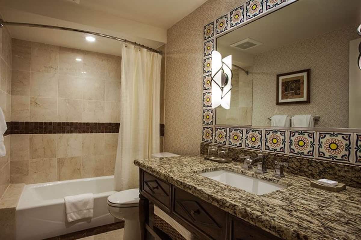 shower, designer toiletries, hair dryer, towels