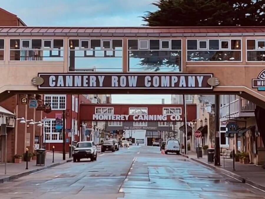 A street view with a large sign for Cannery Row Company.