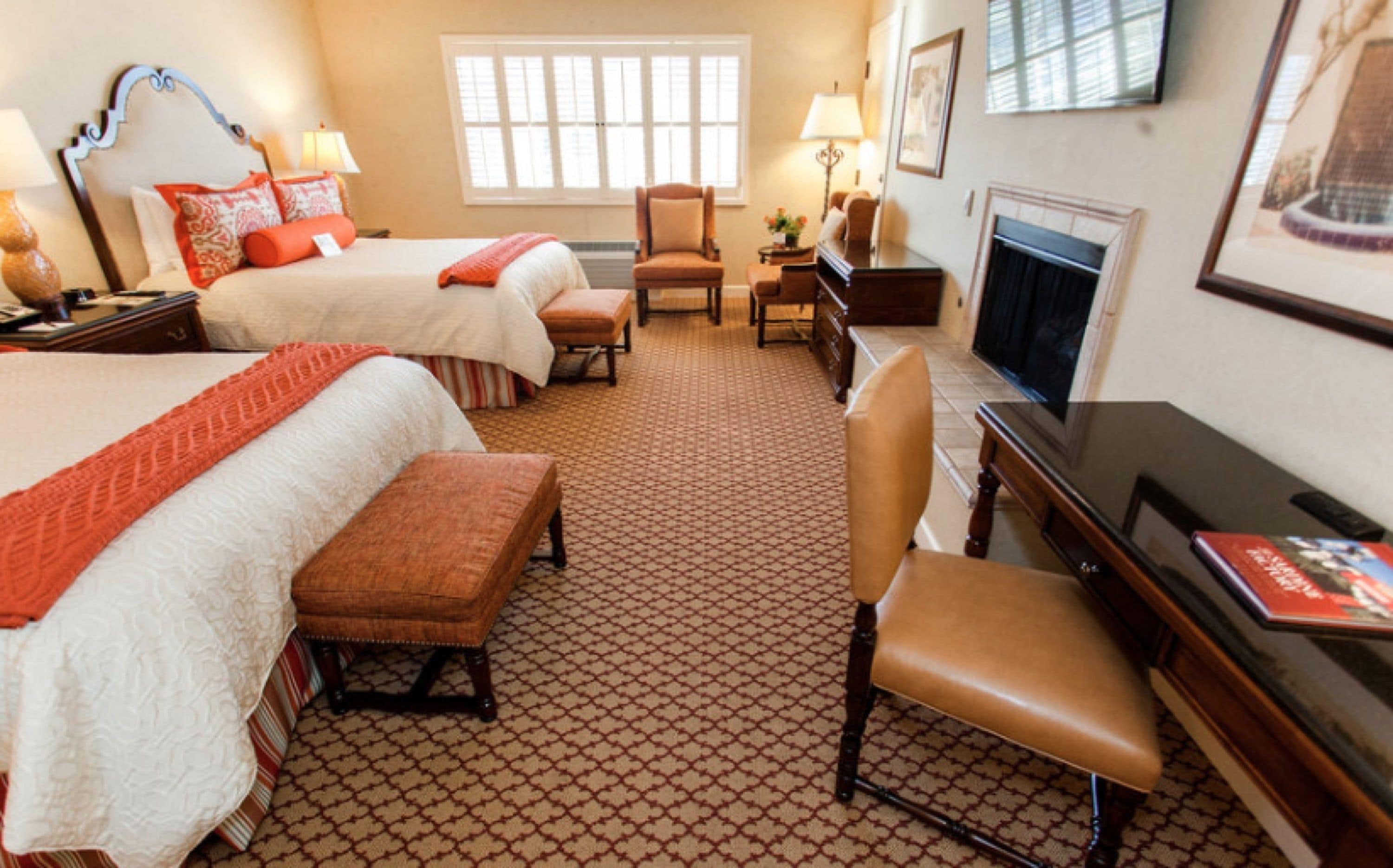 deluxe room, 2 queen beds, fireplace | premium bedding, in-room safe, desk, blackout curtains