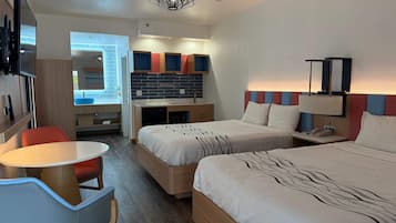 Suite, 2 Queen Beds, Non Smoking | Desk, laptop workspace, blackout curtains, iron/ironing board