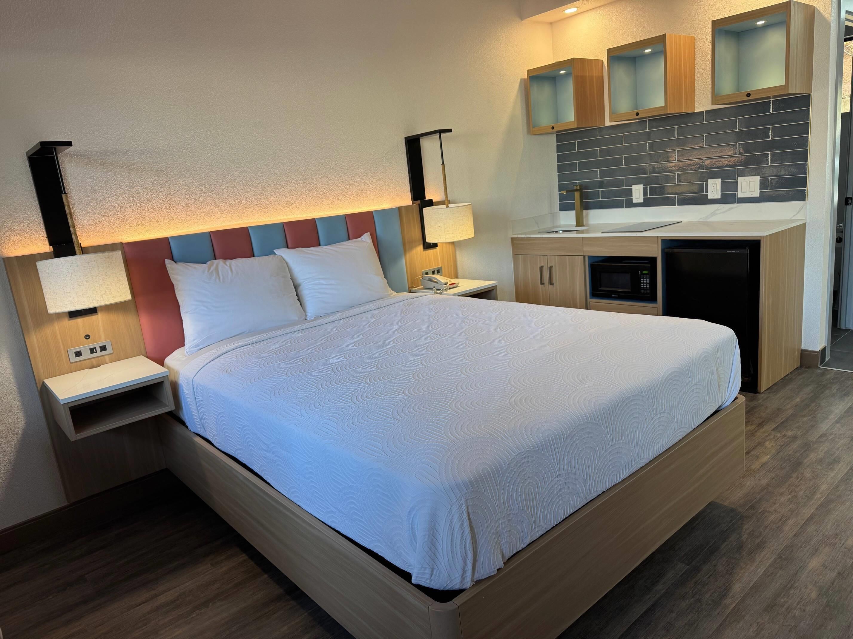 Desk, laptop workspace, blackout curtains, iron/ironing board