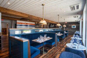 Enjoy a warm and inviting dining experience in our restaurant with comfortable seating areas and a cozy atmosphere.