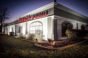 Canada by Wyndham features a symmetrical facade with an arched window and smaller windows on either side.