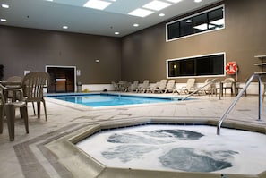 Indoor pool, open 8:00 AM to 11:00 PM, pool loungers