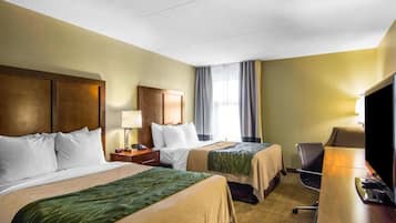 Premium bedding, desk, laptop workspace, blackout drapes