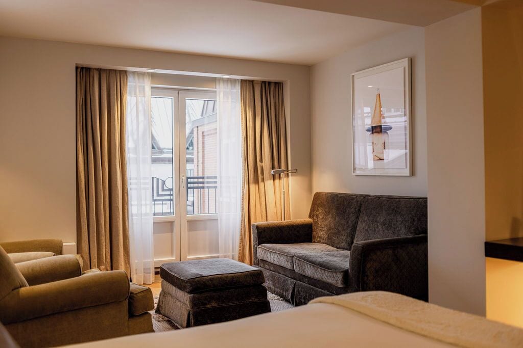 luxury room, 1 king bed | living area | flat-screen tv, dvd player, pay films