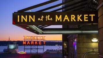 A hotel sign with "INN at the MARKET" and a "PUBLIC MARKET" sign in the background.