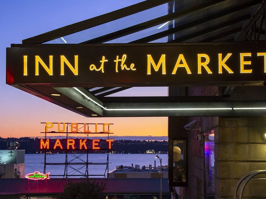 A hotel sign with "INN at the MARKET" and a "PUBLIC MARKET" sign in the background.