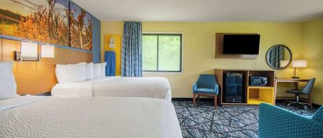 A hotel room with two beds, a desk, a chair, a TV, and a large window.