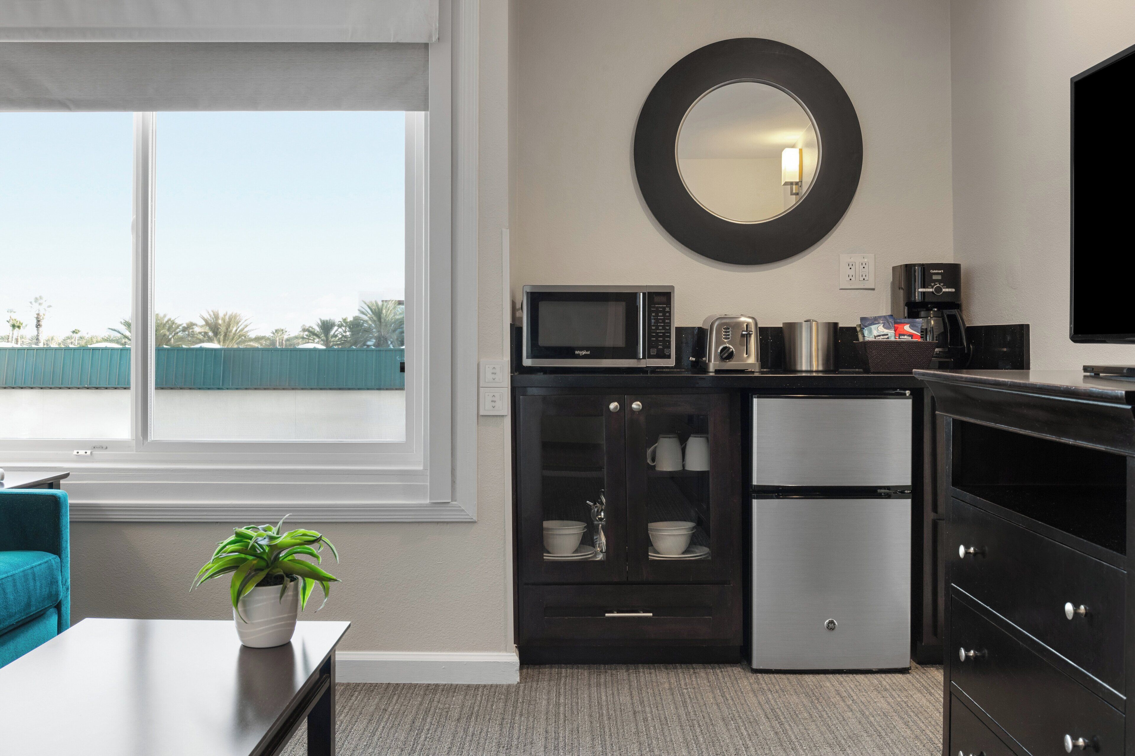 fridge, microwave, coffee/tea maker, cookware/dishes/utensils