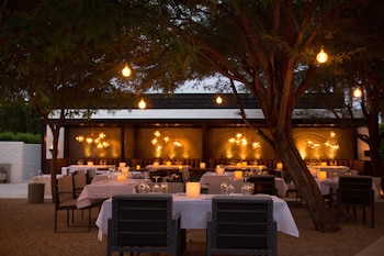 Dinner served, American cuisine, garden views  at LHorizon Resort & Spa, Hermann Bungalows
