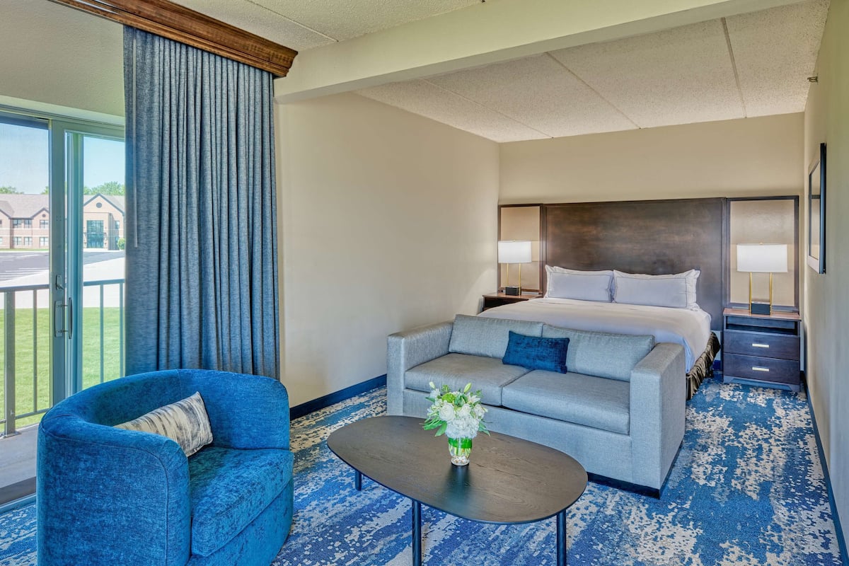 Deluxe Room, 1 King Bed with Sofa bed, Balcony, River View | Living area | LCD TV, MP3 dock