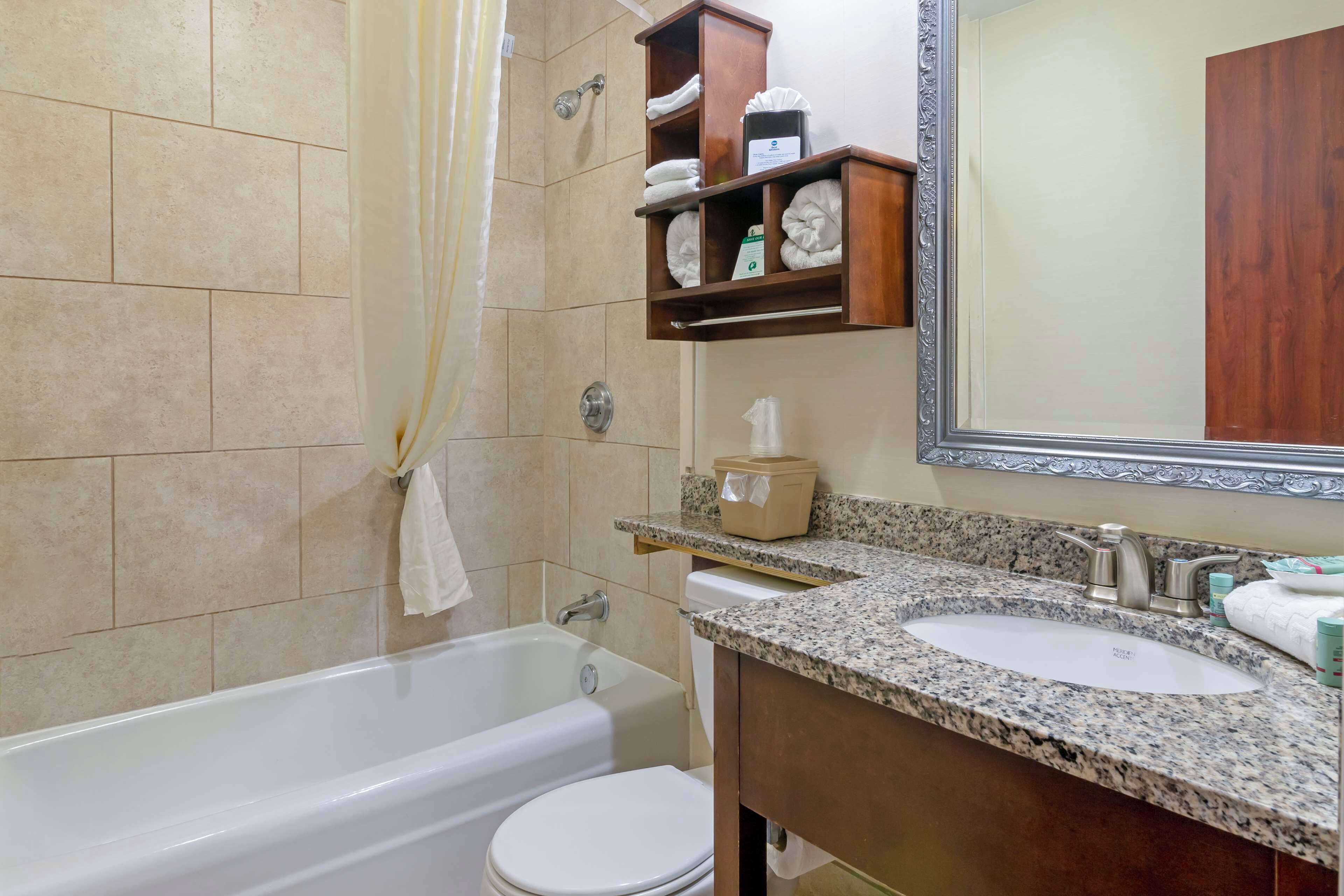 standard room, 2 queen beds, non smoking, refrigerator & microwave | bathroom | combined shower/bathtub, free toiletries, hair dryer, towels