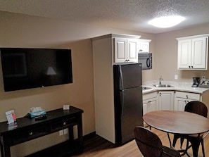 Suite, One King Bed, Non-Smoking | In-room safe, desk, blackout curtains, iron/ironing board