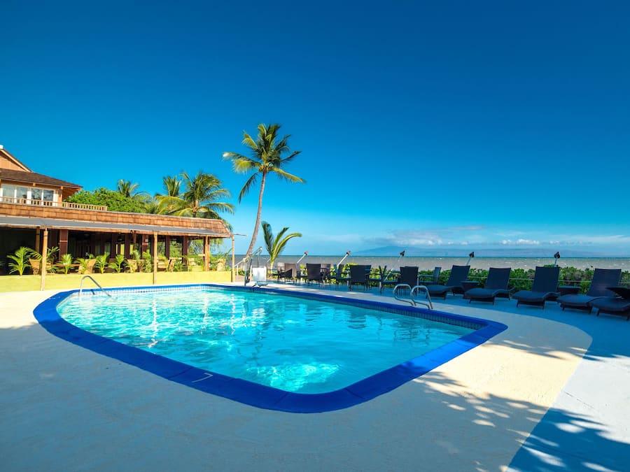 Outdoor pool, open 9:00 AM to 9:00 PM, pool umbrellas, pool loungers