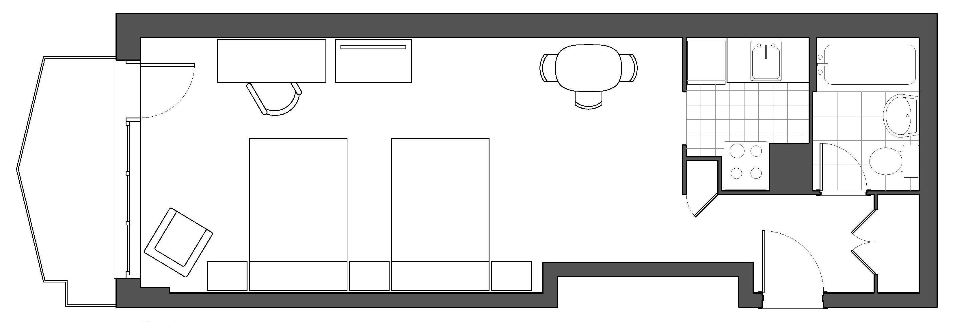 A floor plan of a hotel room with a kitchenette, a dining area, a bathroom, and a small sitting area.