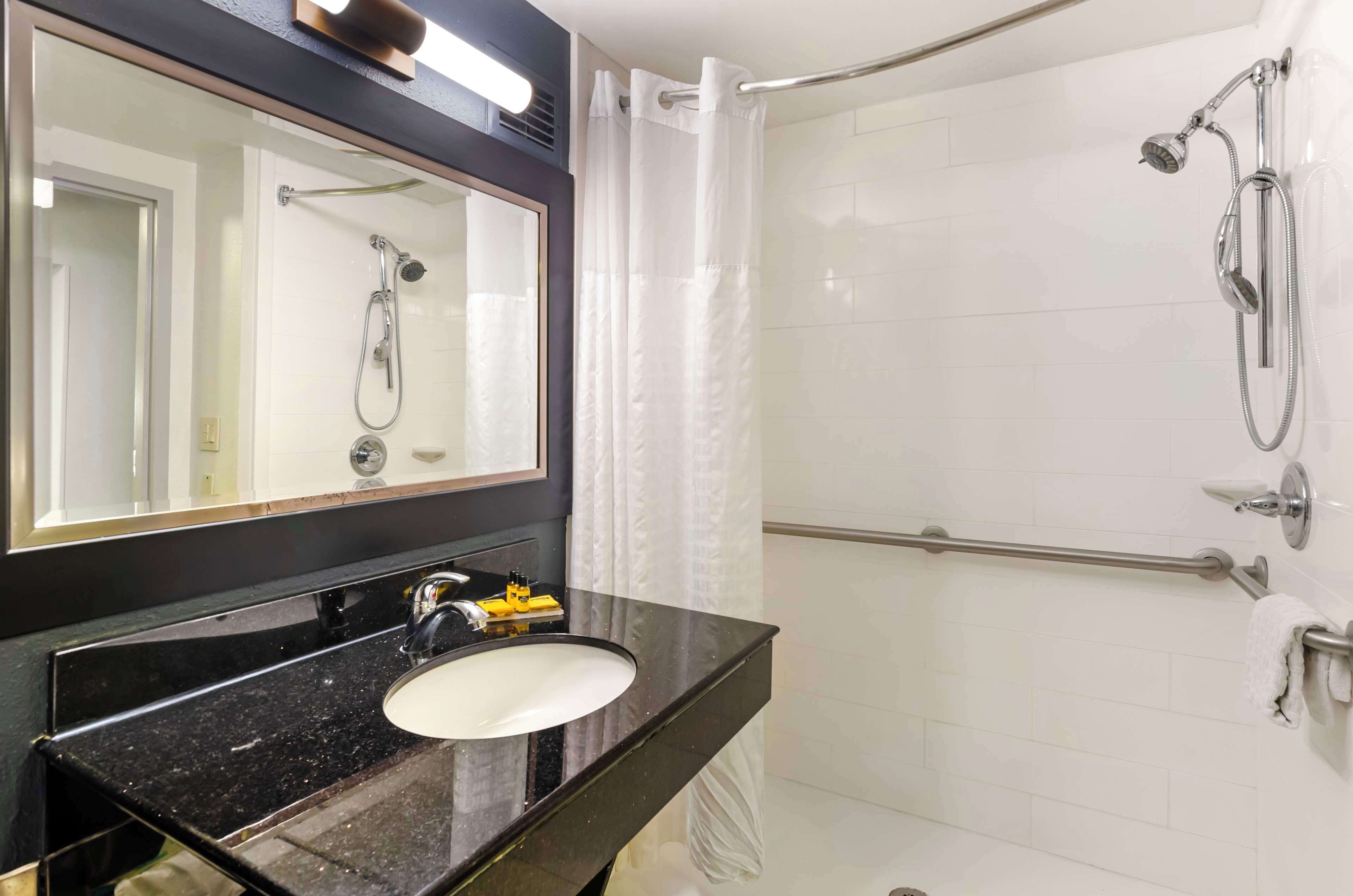 suite, 1 king bed, accessible, refrigerator & microwave | bathroom | combined shower/bathtub, free toiletries, hair dryer, towels