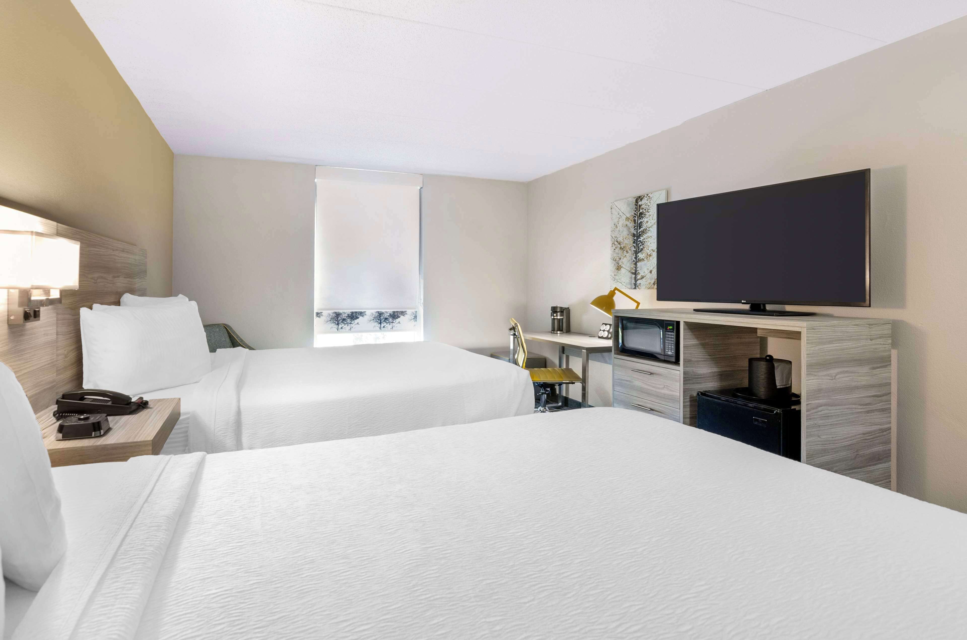 standard room, 2 queen beds, non smoking, refrigerator & microwave | 1 bedroom, in-room safe, desk, blackout curtains