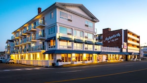 A multi-story hotel with balconies, large windows, and a sign reading "Ashworth by the Sea". - Ashworth by the Sea (Hampton)