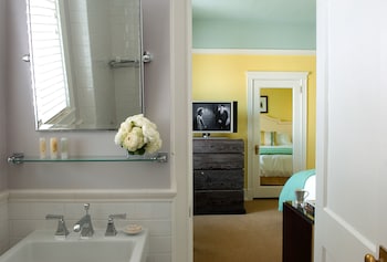 Designer toiletries, hair dryer, bathrobes, towels at Hotel deLuxe