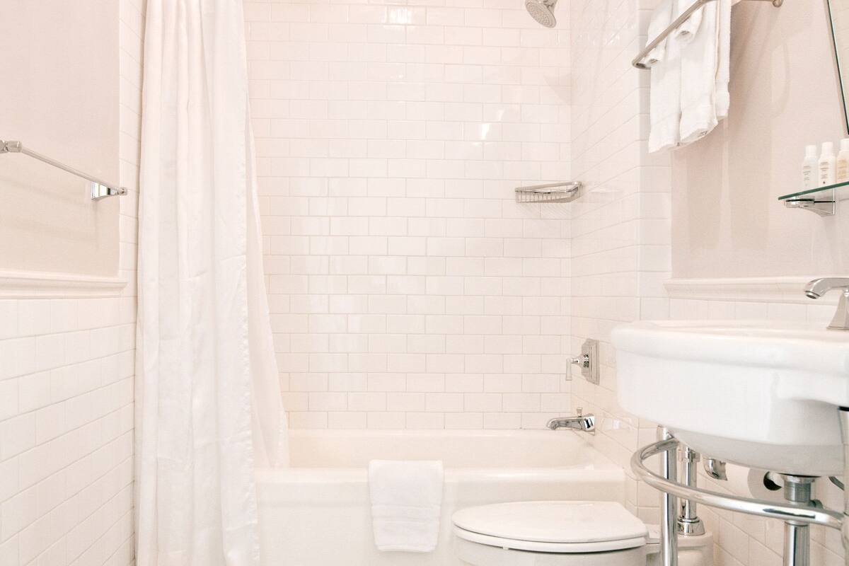 designer toiletries, hair dryer, bathrobes, towels