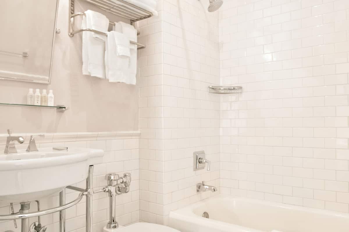 designer toiletries, hair dryer, bathrobes, towels