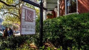 A sign for the Kehoe House, an historic inn, with a traditional design and a signboard. - Kehoe House, Historic Inns of Savannah (Savannah)