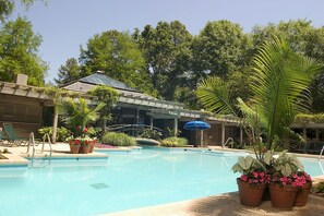 Seasonal outdoor pool, open 8:00 AM to 8:00 PM, pool umbrellas