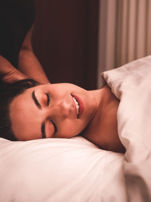 Relax in comfort with a cozy bed against a window, perfect for a peaceful retreat.