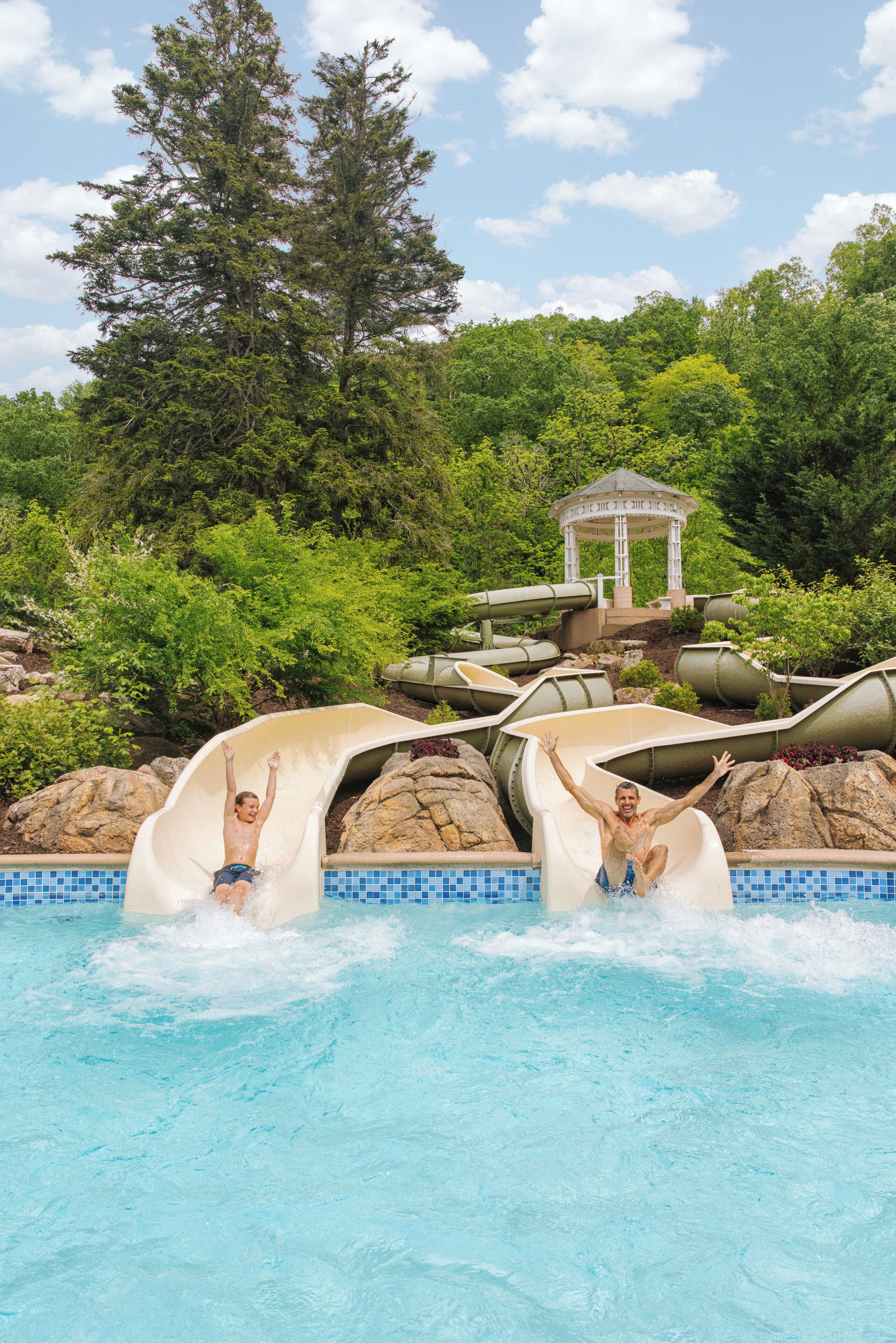 A water slide with a gazebo in the background.