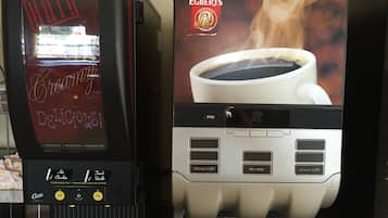 A coffee machine with a Douwe Egberts coffee cup design and a position cup holder.