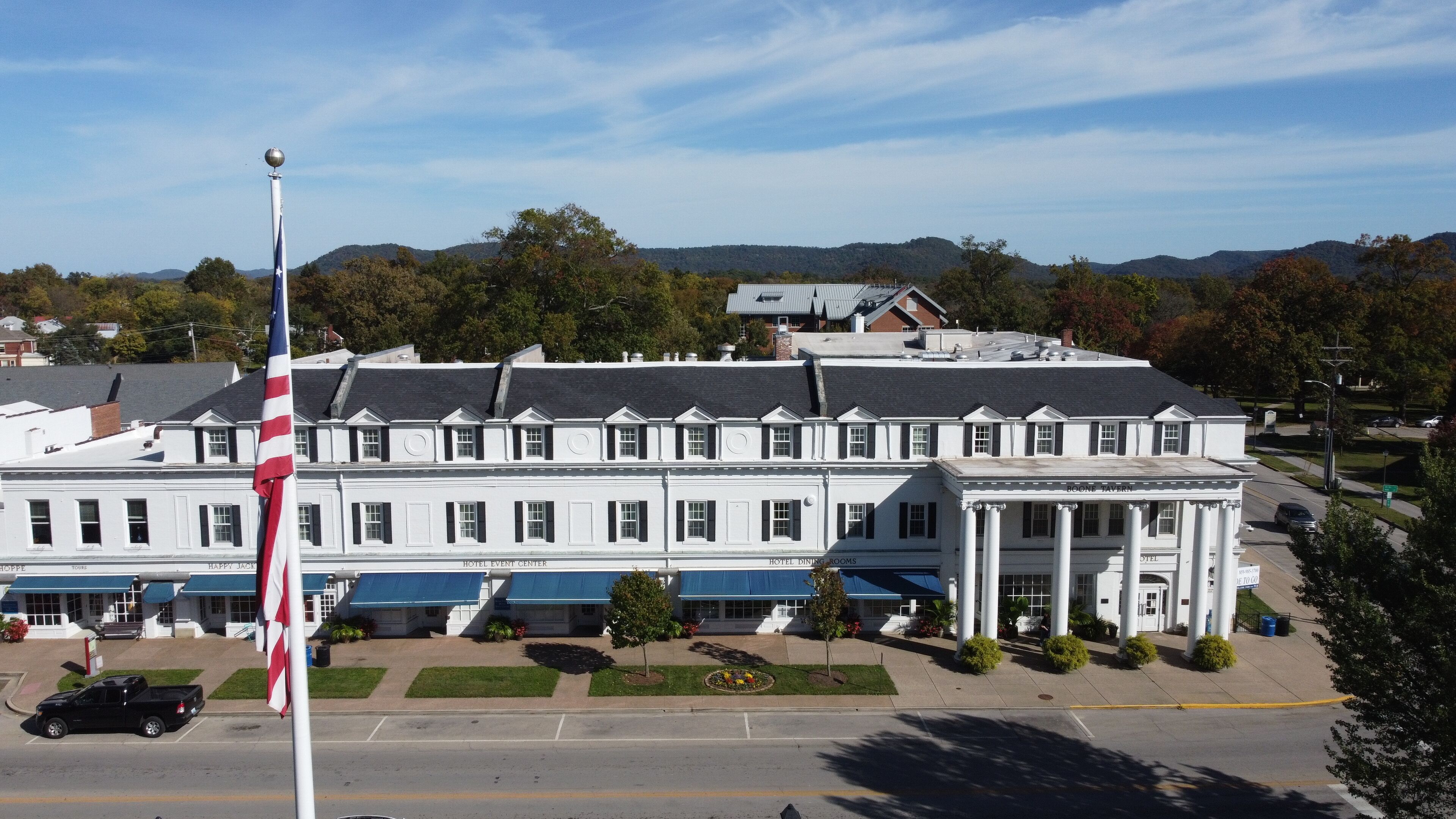 A large, white building with multiple sections labeled "Hotel Event Center," "Hotel Dining Rooms," and "Boone Tavern."