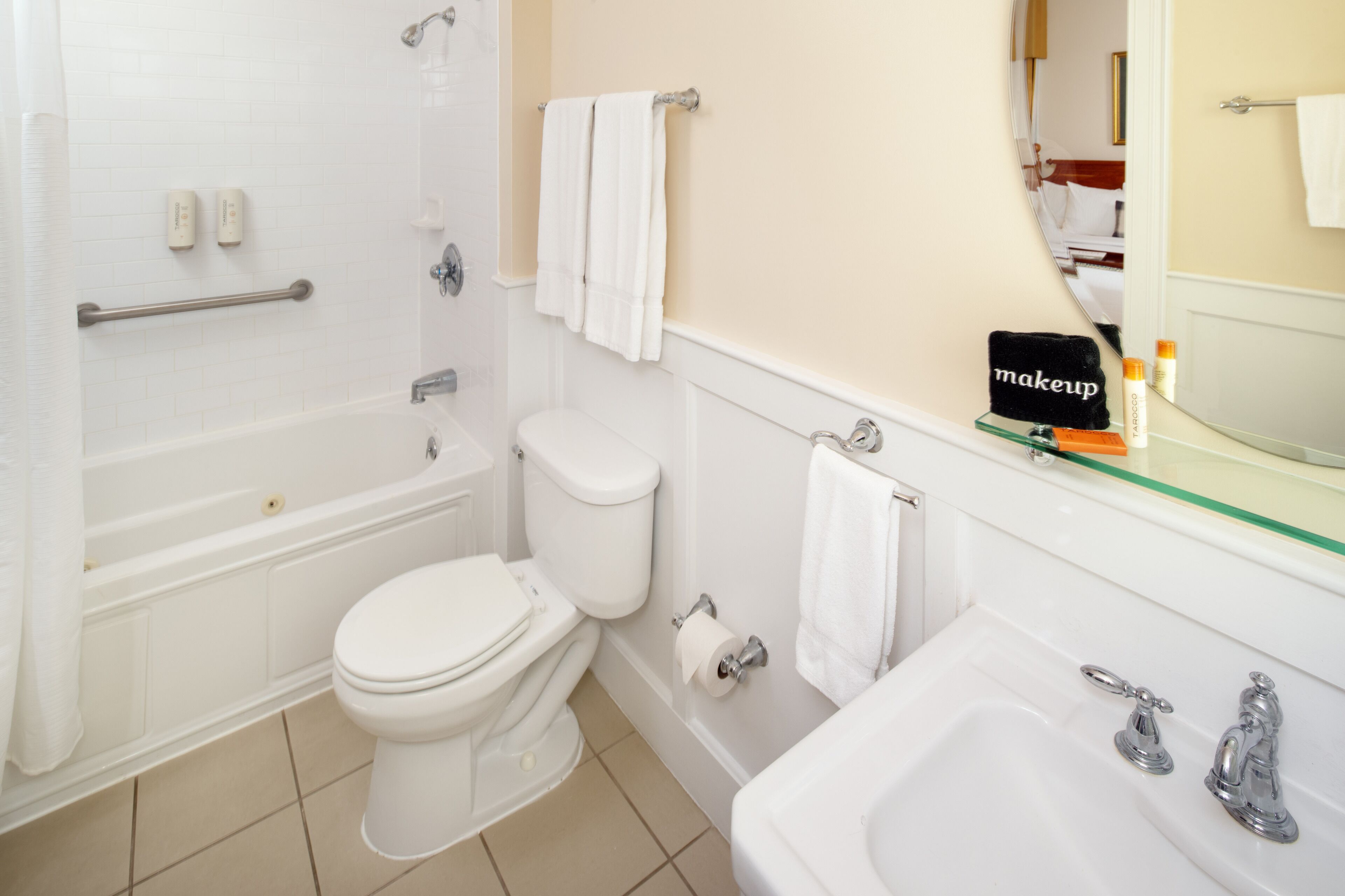 combined shower/bathtub, designer toiletries, hair dryer, bathrobes