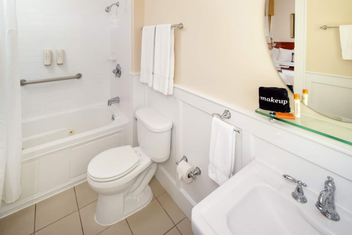 combined shower/bathtub, designer toiletries, hair dryer, bathrobes