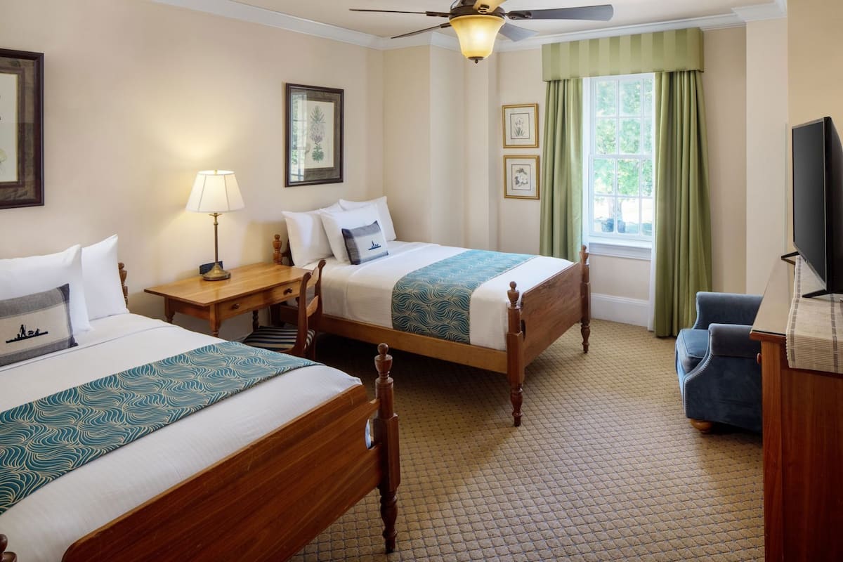 Premium bedding, desk, laptop workspace, blackout curtains