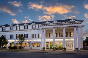 A hotel with a classical facade, columns, and a sign reading "BOONE TAVERN." - Historic Boone Tavern Hotel and Restaurant (Berea)