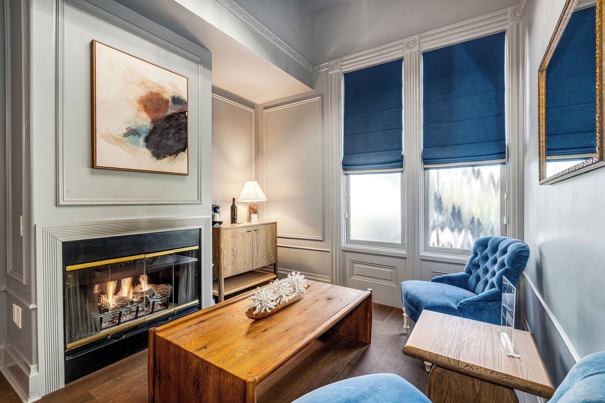 Suite, 1 King Bed | Living area | Flat-screen TV, fireplace