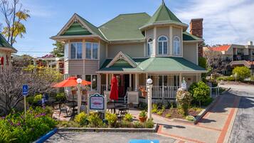 Enjoy a meal on the porch with outdoor seating and a restaurant nearby.