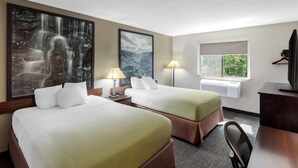 A hotel room with two beds, a large waterfall painting, a window with a view, and a flat-screen TV. - Super 8 by Wyndham Elkins (Elkins)