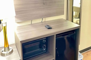 Desk, laptop workspace, blackout drapes, iron/ironing board