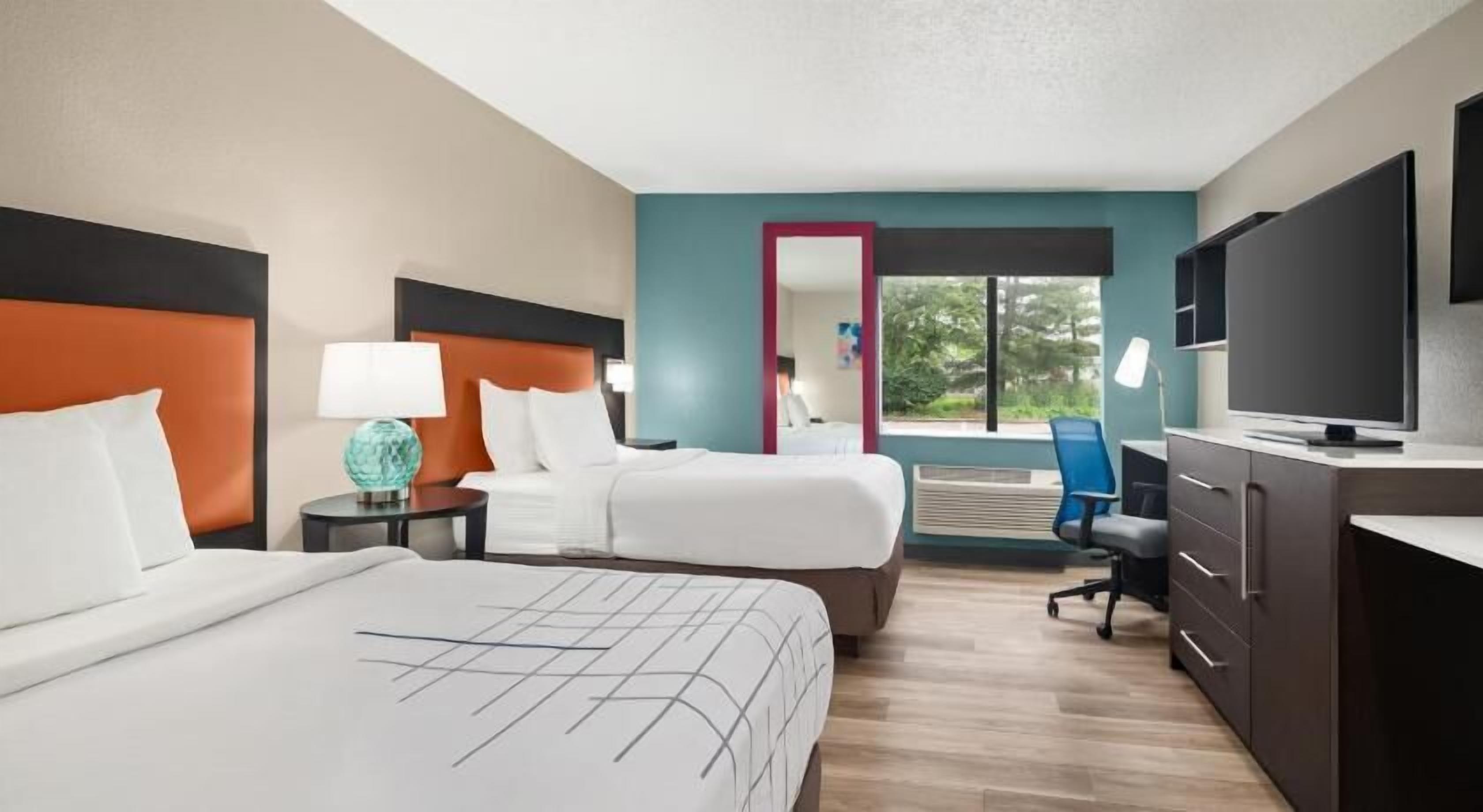 Premium bedding, pillowtop beds, desk, laptop workspace